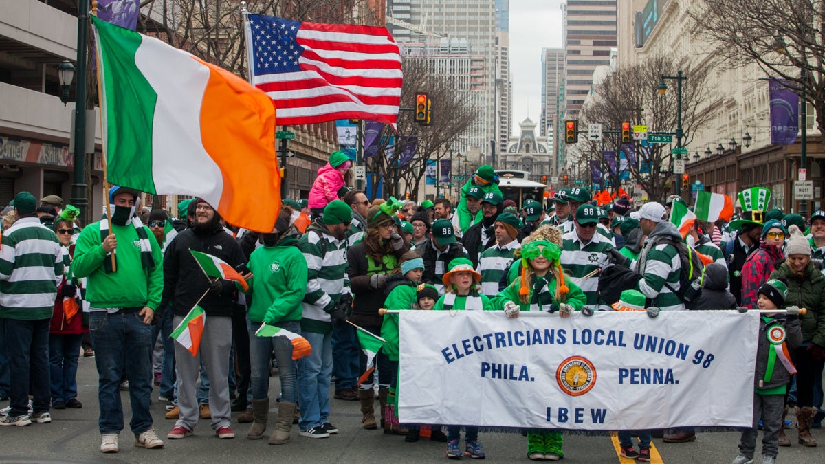 Members of Electricians Local Union 98 and their families march in the Saint Patrick's Day Parade on Market Street Sunday. (Brad Larrison for NewsWorks)