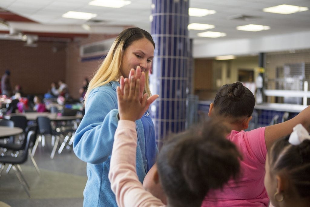 In her after school job, Savannah gravitates towards working with the youngest children. (Jessica Kourkounis/For Keystone Crossroads)