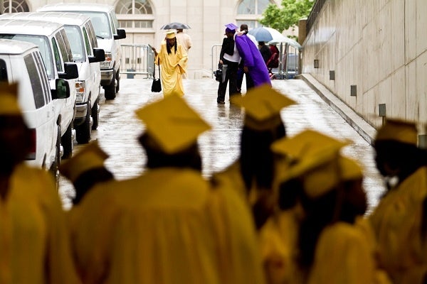 <p><p>23. A soon-to-be graduate gets a hug on a rainy afternoon before the start of the Martin Luther King High School graduation ceremony at the Liacouras Center on Tuesday. (Brad Larrison/for NewsWorks)</p></p>

