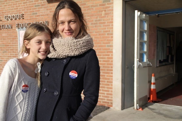 <p><p>Lola Culp-Osborne joins her mother Tara Culp at the polls. (Trenae V. McDuffie/for NewsWorks)</p></p>
