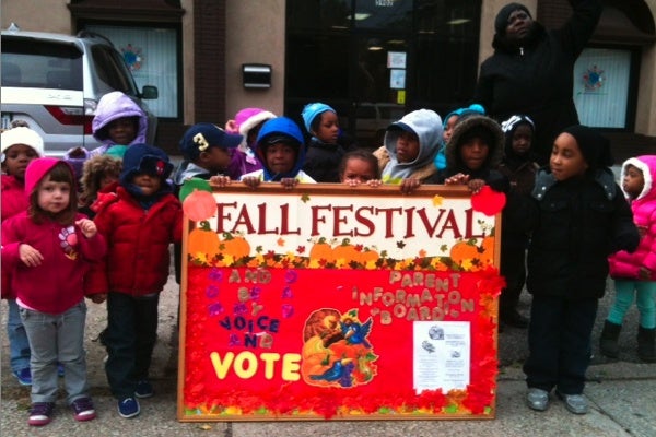 <p><div>Children from Arising Futures childcare and development center urge passersby to vote at Greene and Rittenhouse streets in Germantown. (Shai Ben-Yaacov/WHYY)</div></p>
