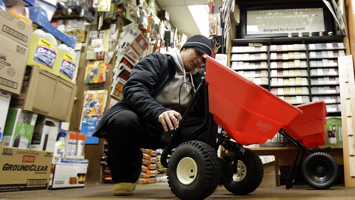  Marco Iuele inspects a salt spreader while shopping at Meadowlands Hardware, Jan. 2, 2014, in East Rutherford, N.J. (AP Photo/Julio Cortez) 