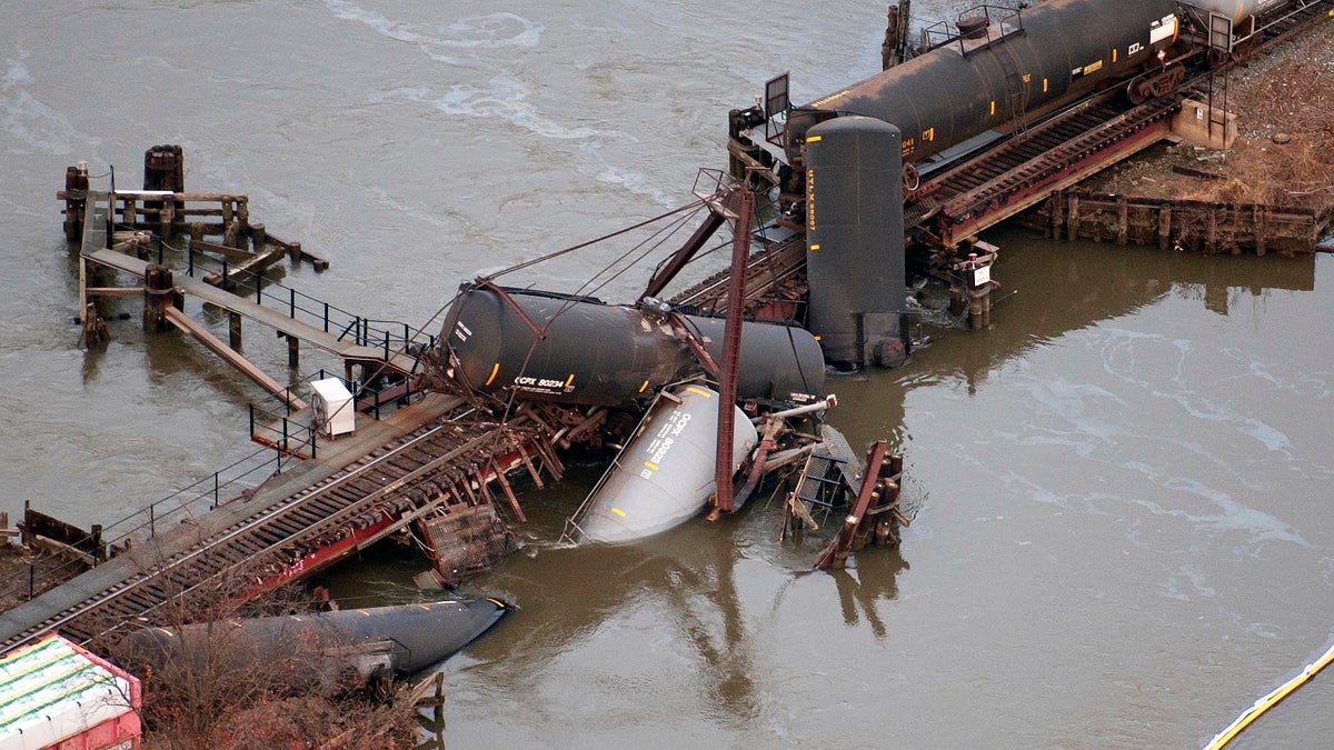 Derailed freight train cars lie in water in Paulsboro, N.J., in 2012. (AP Photo/Cliff Owen) 