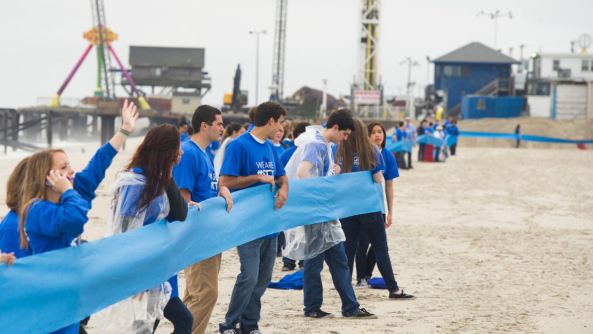  A record breaking five mile long ribbon stretches along the beach linking some of the shore towns that were hardest hit by Superstorm Sandy, on Friday, May 24, 2013 in Seaside Heights, N.J. (Photo by Charles Sykes/Invision/AP) 