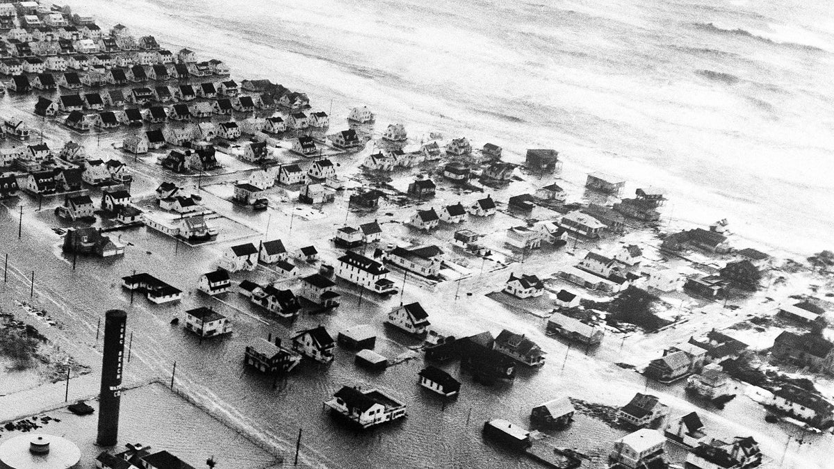  Wind whipped tidal waters of the Atlantic inundate a community on Long Beach Island off the New Jersey coast on March 8, 1962. (AP File Photo) 