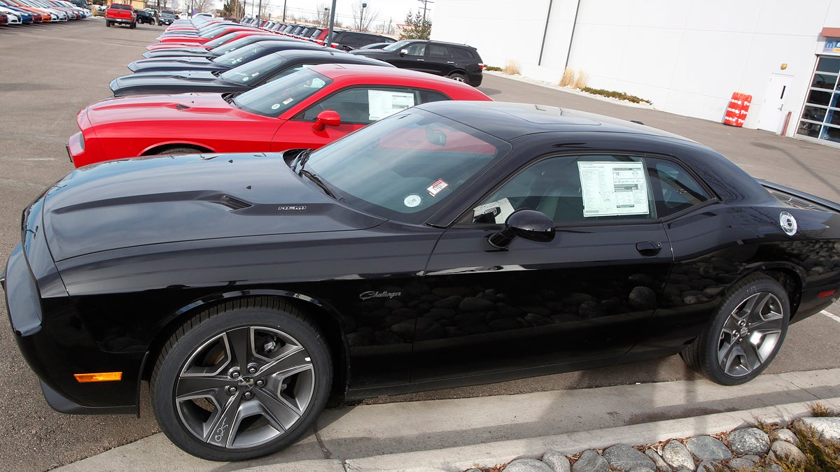 In this file photograph taken on Sunday, Jan. 20, 2013, a line of 2013 Challengers sits at at a Dodge dealership in Littleton, Colo. (AP Photo/David Zalubowski)