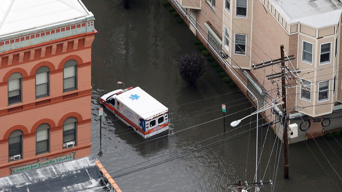  An ambulance drives through a flooded street in Hoboken, N.J. in the wake of Superstorm Sandy on Tuesday, Oct. 30, 2012. (Mike Groll/AP Photo) 