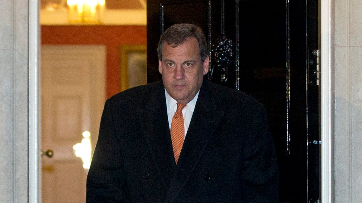  New Jersey Gov. Chris Christie looks towards the media leaves 10 Downing Street following a meeting with Britain's Prime Minister David Cameron, in London Monday, Feb. 2, 2015. (AP Photo/Alastair Grant) 