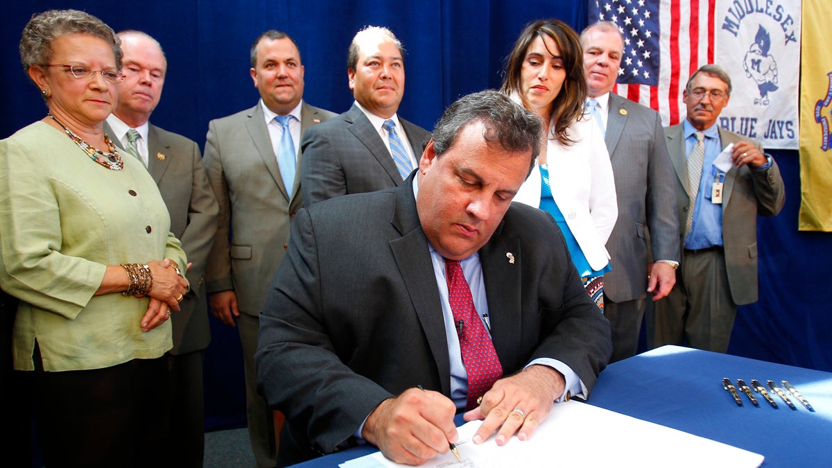  Gov. Christie signs the teacher tenure reform bill on Aug. 6, 2012.  (AP Photo/Rich Schultz) 