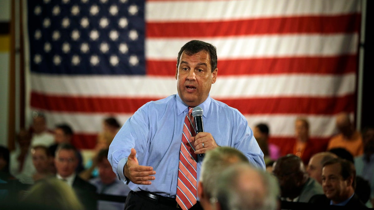  A large American flag is part of Christie's town hall setting,  Christie in Haddon Heights, NJ in 2014.  (AP Photo/Mel Evans) 