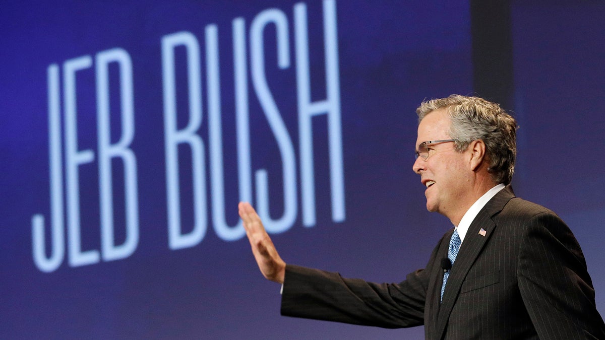 Former Florida Gov. Jeb Bush waves while being introduced before speaking at the National Automobile Dealers Association convention in San Francisco, Friday, Jan. 23, 2015. (AP Photo/Jeff Chiu)