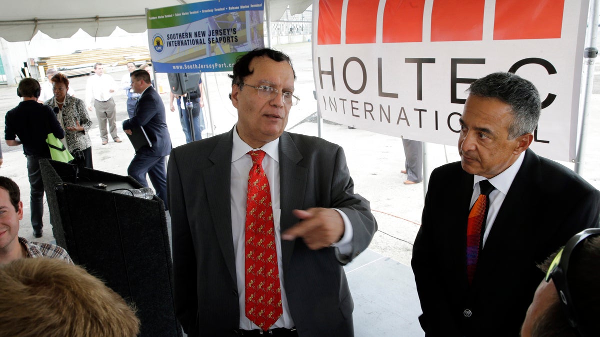  Kris Singh, center, CEO of Holtec International answers a question July 14, 2014, in Camden, N.J.. Holtec plans to build a manufacturing facility at the former site of the New York Shipbuilding Corp. yard. (AP Photo/Mel Evans) 