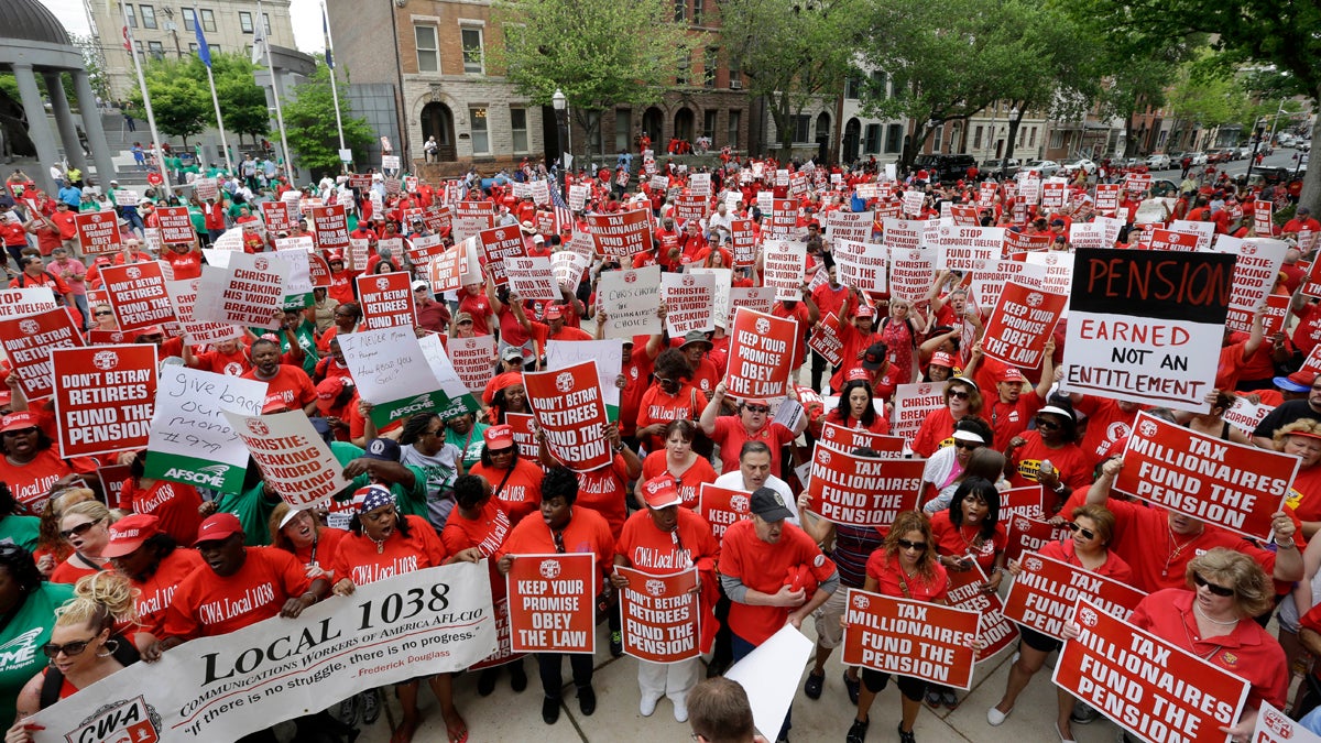  A large crowd of mostly public employee union members fill the plaza and street in front of the Statehouse Tuesday, May 12, 2015, in Trenton, N.J. The unions are protesting of Gov. Chris Christie's pension funding reductions. (AP Photo/Mel Evans) 