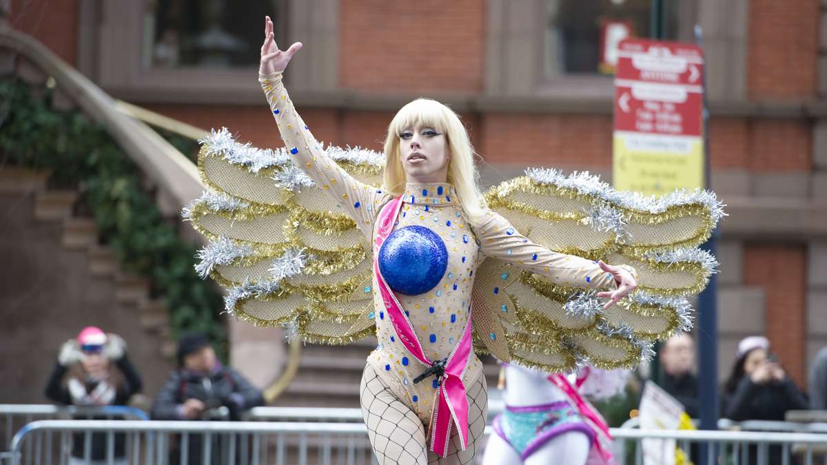  A member of the Miss Fancy Brigade performs in front of the Union League on South Broad Street. (Jonathan Wilson/for NewsWorks) 