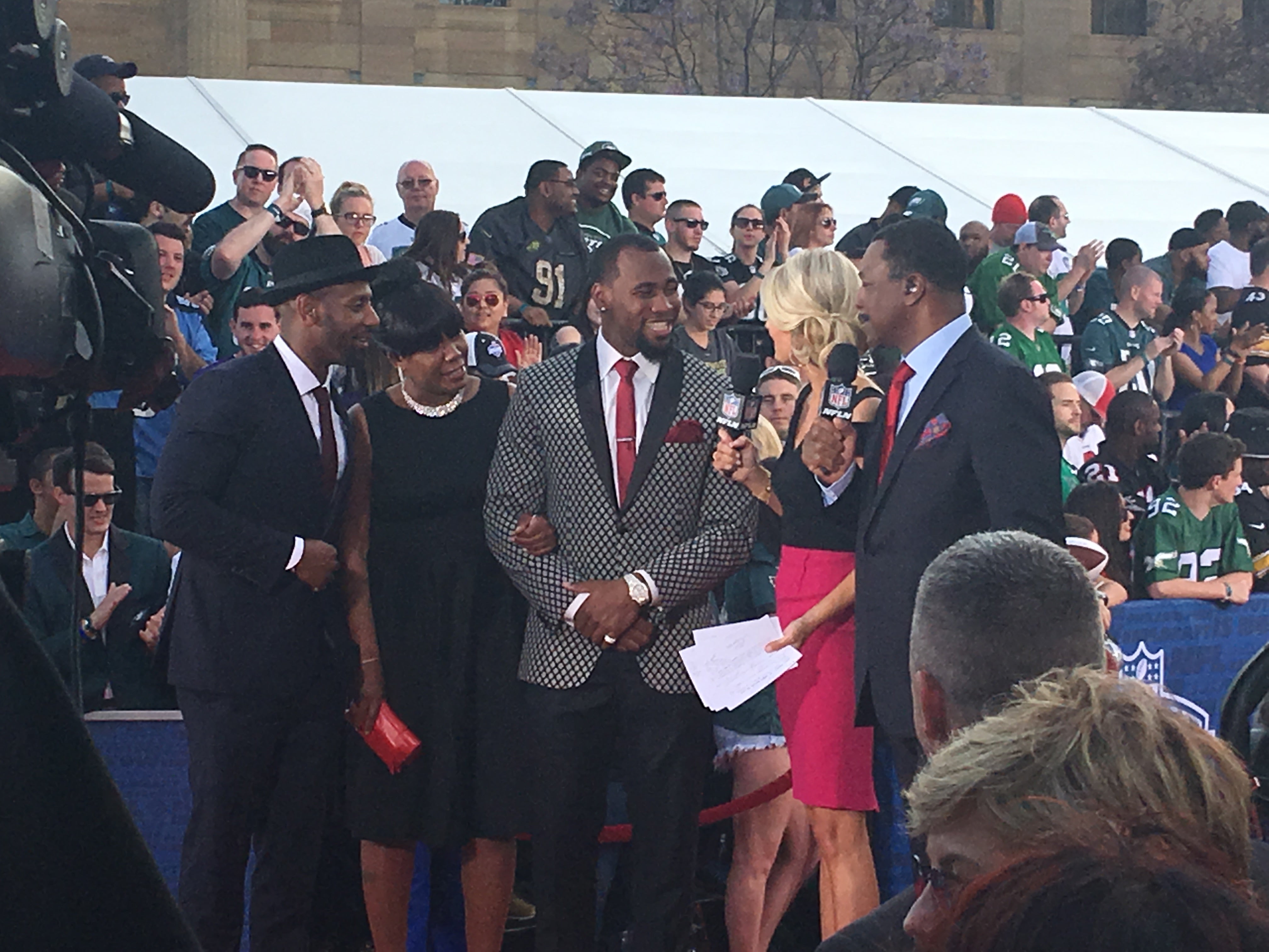  Haason Reddick, a Camden native and standout at Temple, is interviewed by the NFL Network's Melissa Stark and actor Carl Weathers prior to the first round of the NFL Draft. (Jay Scott Smith/WHYY)  