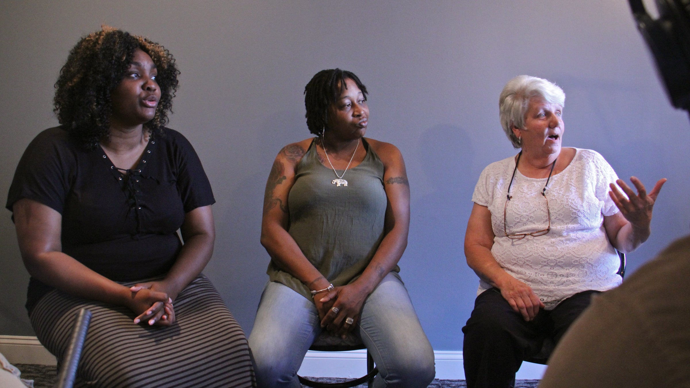 Paulsboro residents (from left) Erica Scott, Christa Cooper and Sheryl Haas discuss the issues faced by their town and state in light of the race for governor. (Emma Lee/WHYY)