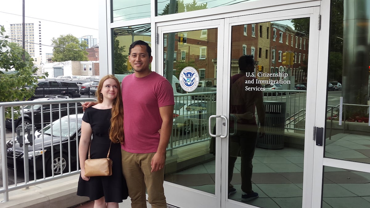  Lillie Williams and Jonatan Palacios stand outside the offices of U.S. Citizenship and Immigration Services in West Philadelphia after completing an interview to determine the legitimacy of their marriage. (Laura Benshoff / WHYY) 