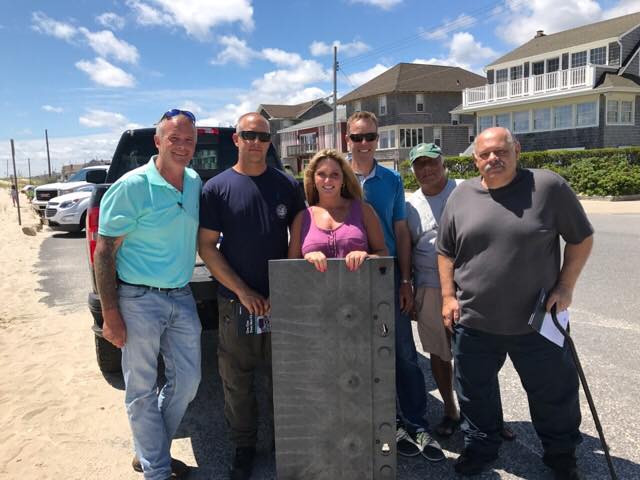  (L to R): Beach Days for All's Chris Aldrich, Seaside Park Public Works Director Eric Wojciechowski, Beach Days for All's Jessica Krill, Joseph Wright of Matrax, Inc., Seaside Park Councilman Ray Amabile, and Seaside Park Borough Administrator Bob Martucci stand in front of a Seaside Park beach.  