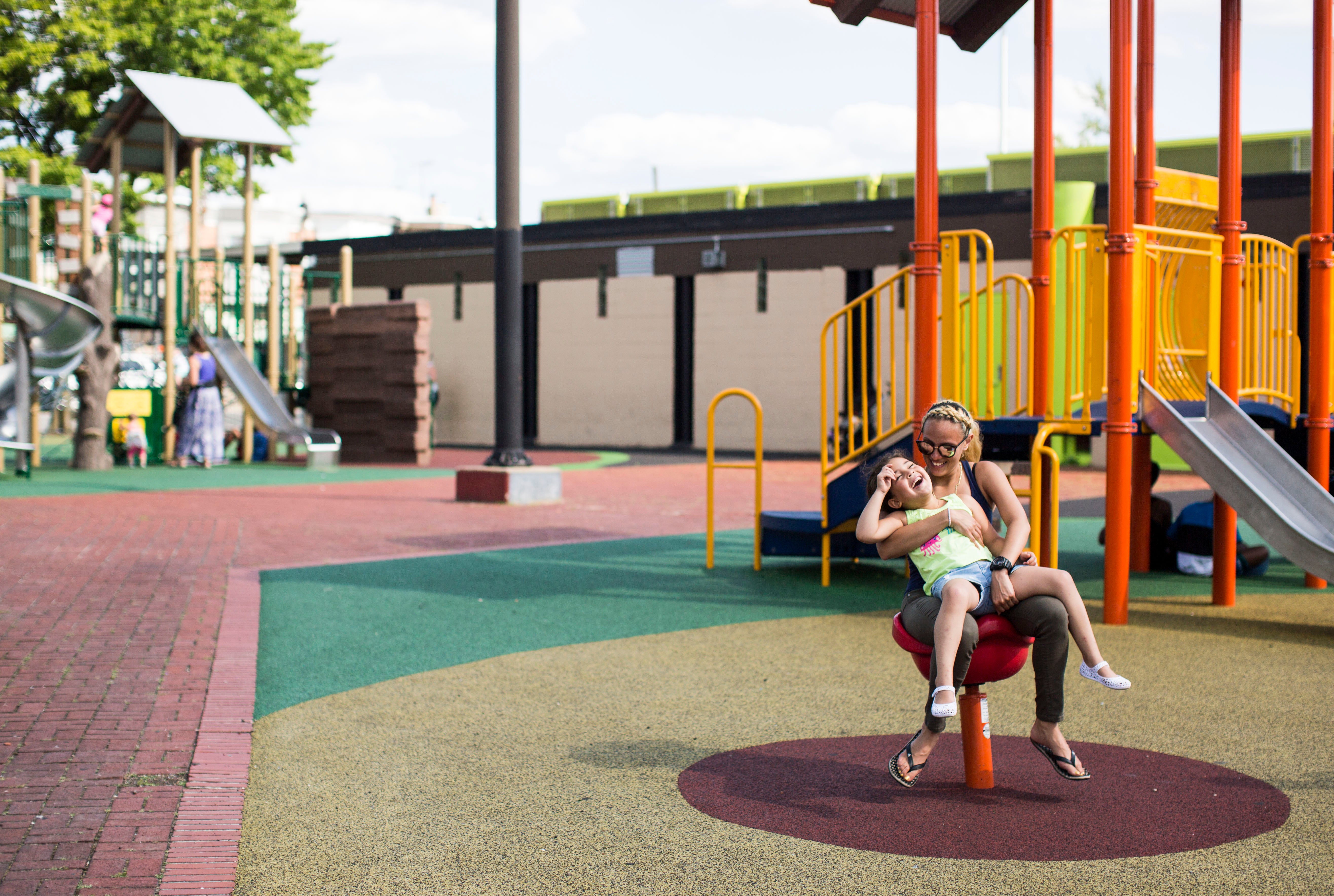 </b> Savannah Zayas and her daughter Layla play at Cione Playground in Kensington on June 29, 2016. Savannah doesn't take Layla to parks in her own neighborhood. (Jessica Kourkounis)