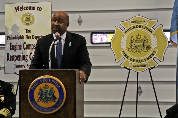 <p>A Local 22 member yells through the window for the recall of Mayor Michael Nutter as he speaks at the dedication of Engine 38 in the Tacony section of Philadelphia. (Kimberly Paynter/WHYY)</p>
