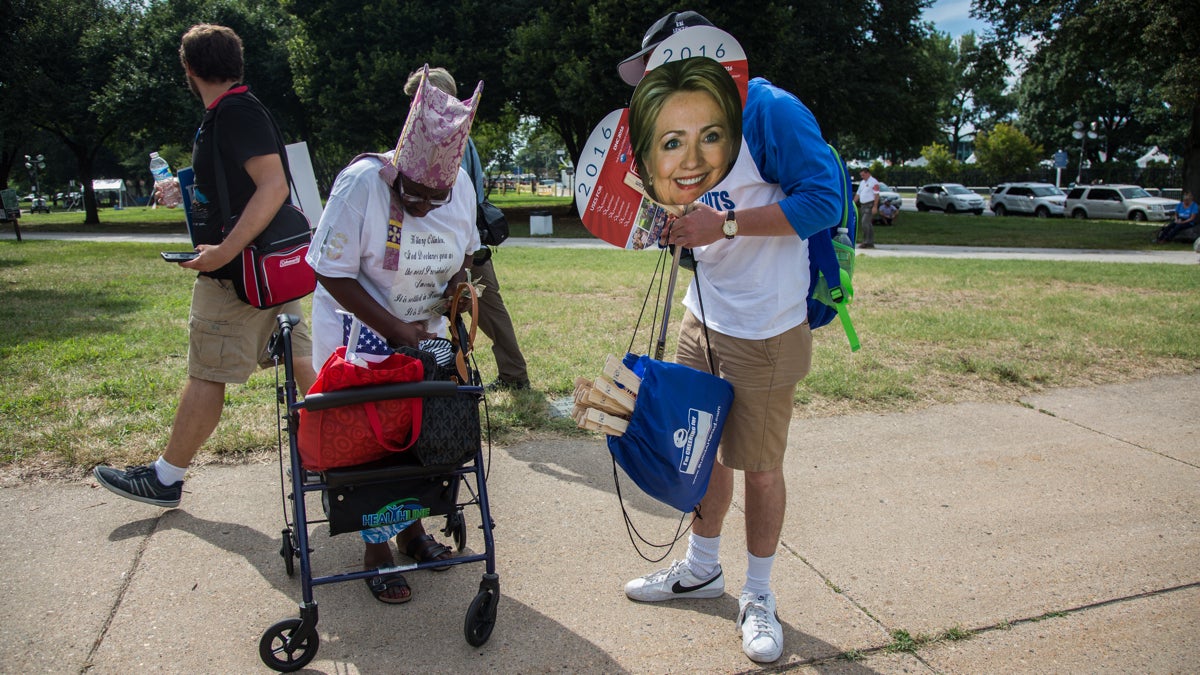  Street vendors sell Hillary Clinton and Bernie Sanders head signs to protesters outside of the Wells Fargo Center, site of   the 2016 Democratic National Convention. (Emily Cohen for NewsWorks) 