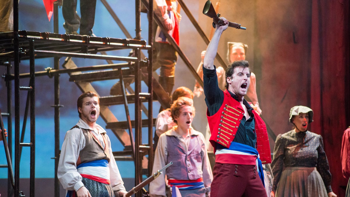  Sean Thompson (in front), leads the student rebels in Media Theatre's production of 'Les Misérables.' (Photo courtesy of Maura McConnell) 