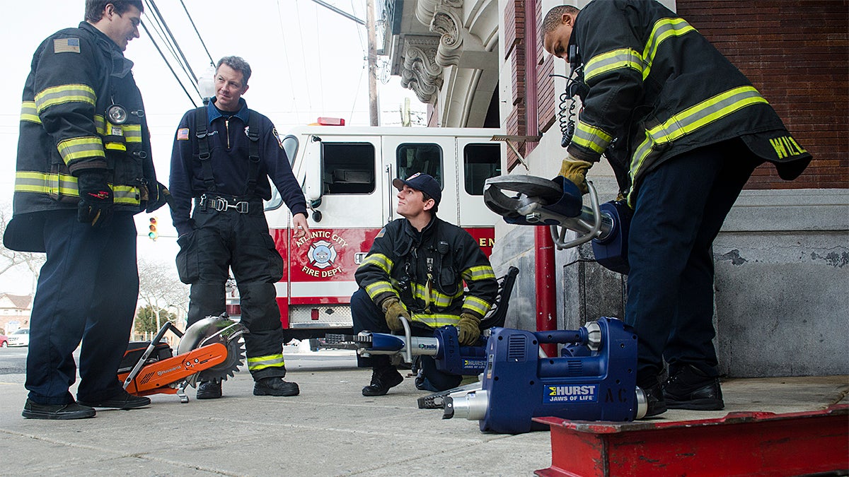  Atlantic City firefighters from Station 4,  Engine 4, Ladder 2, California Ave. prepare for duty. (Anthony Smedile for NewsWorks) 