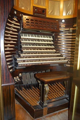 <p><p>The organ keyboard and pedals are contained within a tight space inside the carousel.  (Mary Cummings Jordan/WHYY)</p></p>
