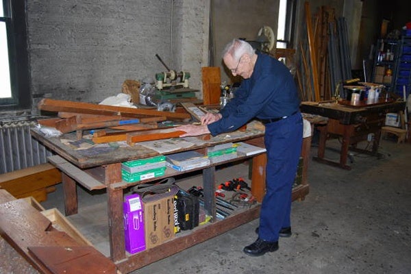 <p><p>Buddy Grover, 84, works to restore a piece of the organ.  (Mary Cummings Jordan/WHYY)</p></p>
