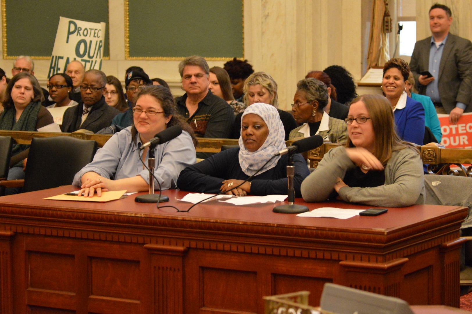  Homecare worker Kaliena Stewart (center) testifies at hearing Monday before a City Council panel. (Tom MacDonald, WHYY) 