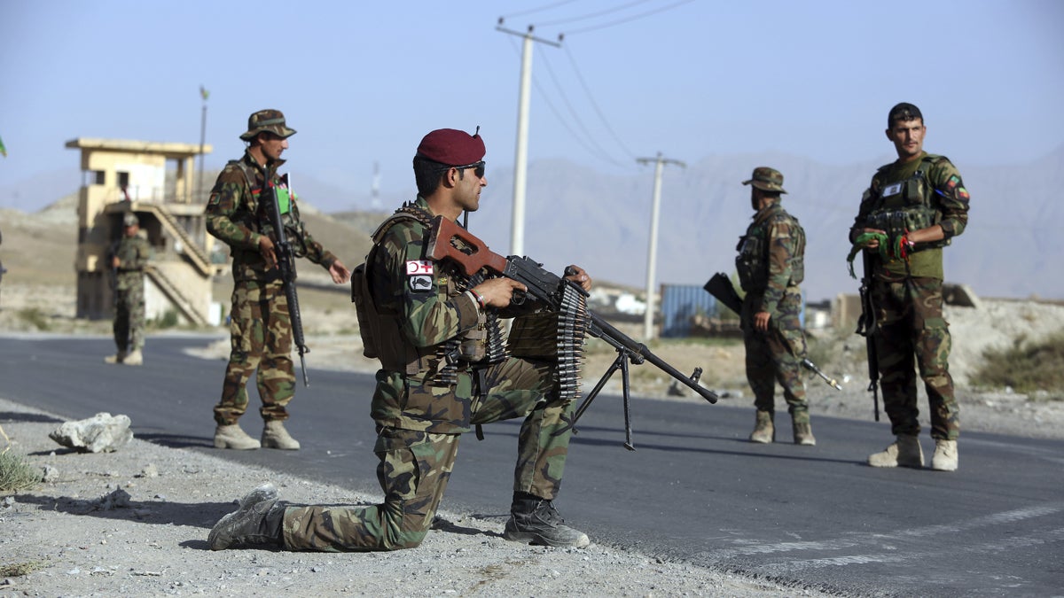  Afghan national army (ANA) Soldiers stand guard at a checkpoint on the outskirts of Kabul, Afghanistan, Monday, Aug. 21, 2017. President Donald Trump will use a nationally televised address to outline for a war-weary nation the strategy he believes will best position the U.S. to eventually declare victory in Afghanistan after 16 years of combat and lives lost. (AP Photo/Rahmat Gul) 