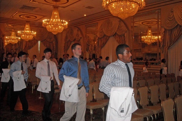 The class of 2015 line up--with white coats folded neatly--at the induction ceremony for Drexel University College of Medicine.