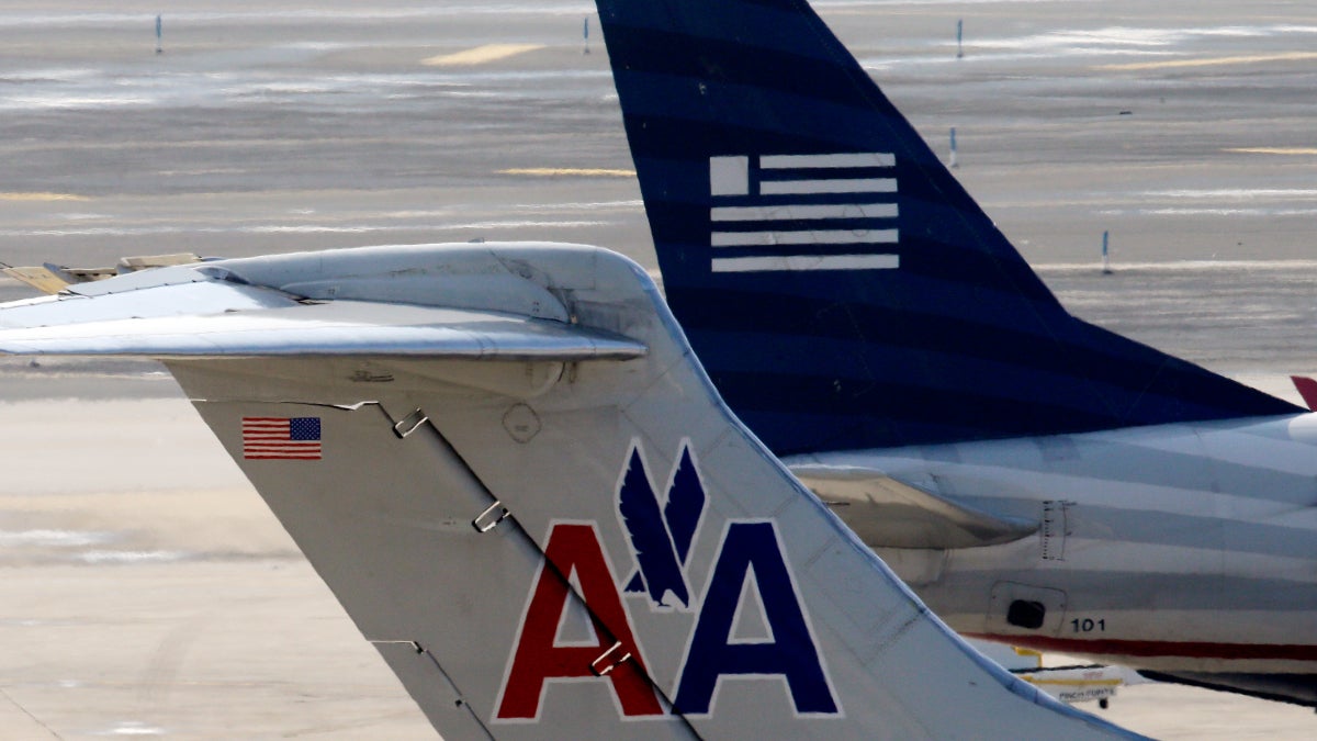 American Airlines and US Airways jets prepare for flight at gate at the Philadelphia International Airport. (AP Photo/Matt Rourke) 