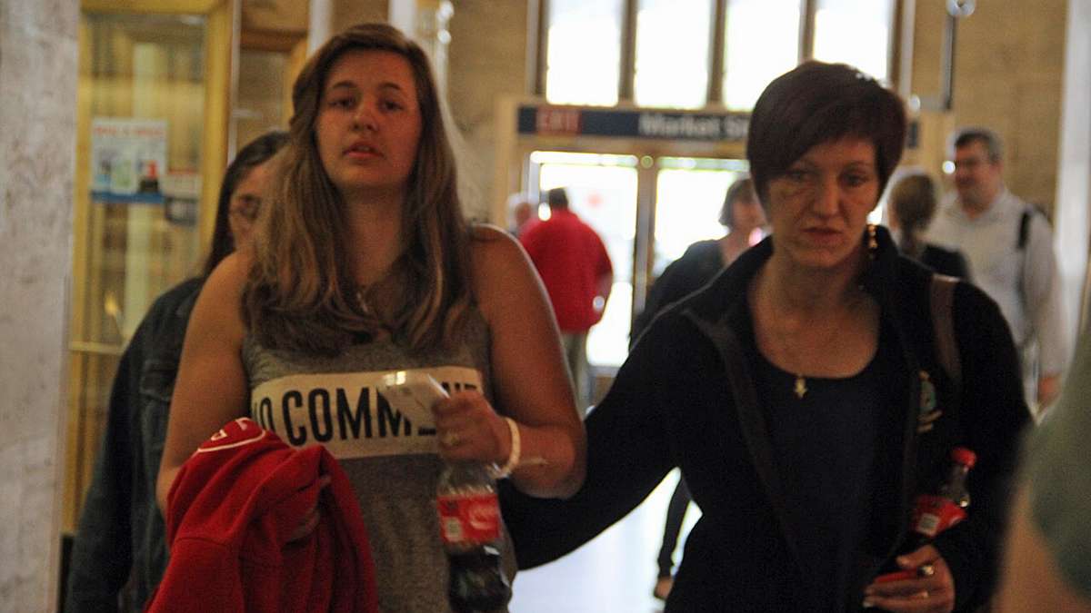 After a harrowing night that included an emergency room visit, derailment survivors take refuge at 30th Street Station