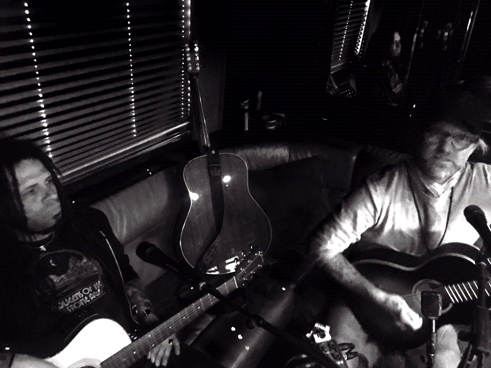  Anders Osborne (right) and Eric McFadden (left) perform a brand-new song for Dave Heller aboard their tour bus Saturday, August 13, 2016. (Photo courtesy of Anders Osborne) 