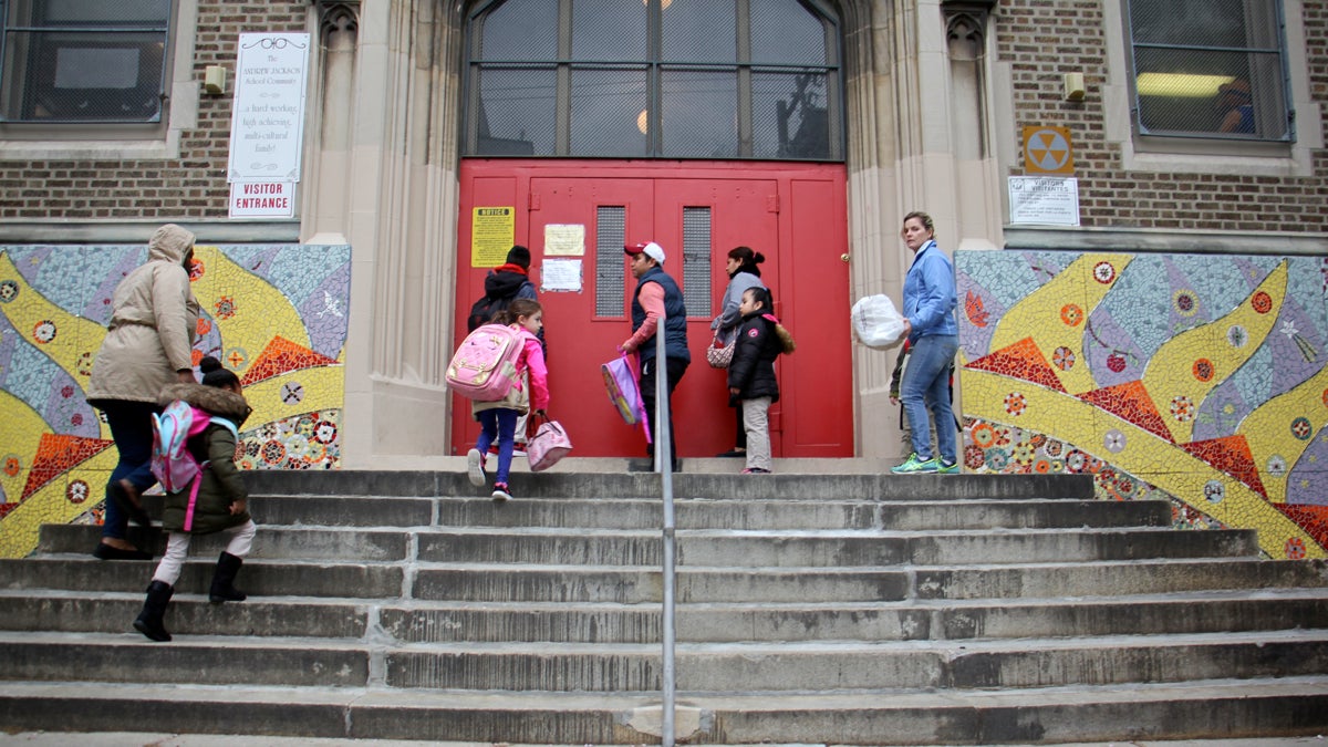 Students arrive at Andrew Jackson Elementary School for the start of the school day. (Emma Lee/WHYY) 