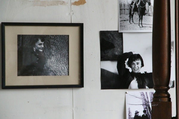 Snapshots of Andrew Wyeth's wife, Betsy, are pinned to his studio wall, as they were during his life. (Emma Lee/for NewsWorks)