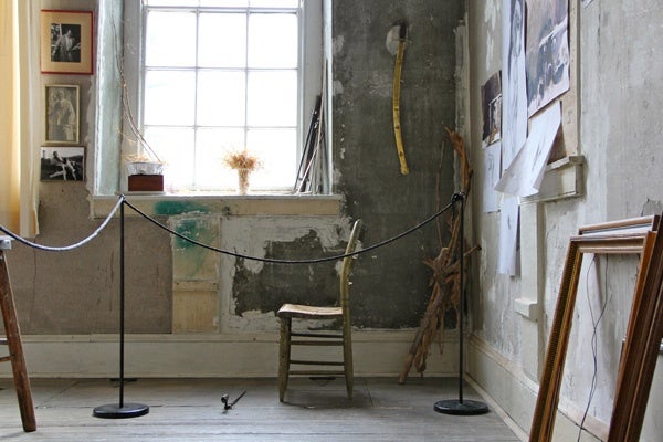 Andrew Wyeth's studio contains treasured possessions, family photographs, and unfinished sketches as well as brushes and paints. (Emma Lee/for NewsWorks)