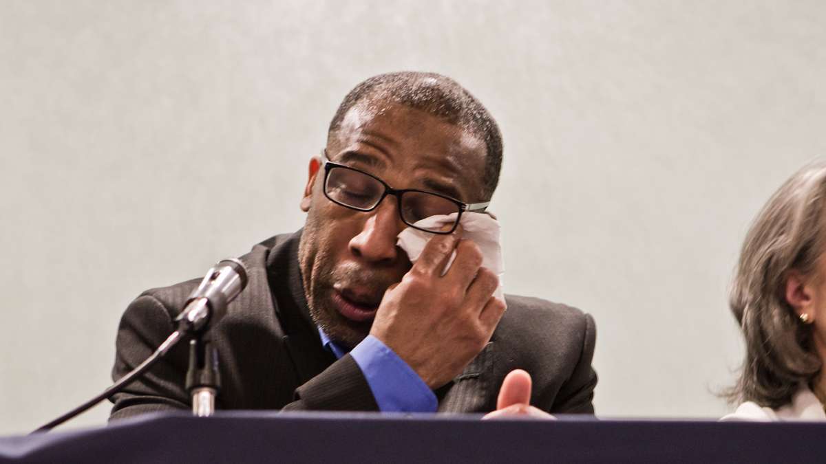 Anthony Wright, 45, was acquitted of a murder conviction, and release from prison after 25 years Tuesday. Wright wipes away tears during a press event (Kimberly Paynter/WHYY)