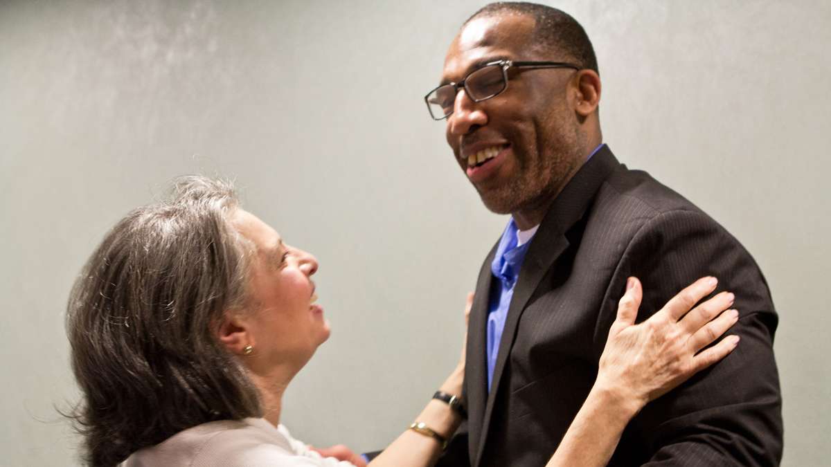 Anthony Wright embraces Rose Greco, a juror at Wright’s second trial who voted to set him free. (Kimberly Paynter/WHYY)