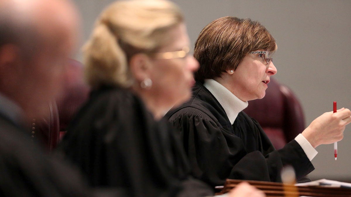 Justices on New Jersey Supreme Court, pictured earlier this month, are reviewing the extent of the state's whistleblower law. (AP Photo/The Record of Bergen County, Chris Pedota, Pool) 