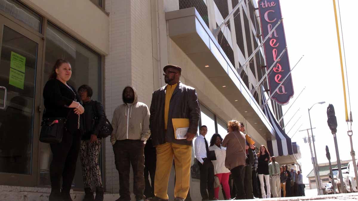  Ronald Roberts, right, waits at the head of the line of applicants for jobs at the Chelsea hotel in Atlantic City last month. Roberts lost his cook's job last August when the Showboat casino closed. Many laid-off casino workers were among those seeking jobs at the Chelsea, even three-month temporary seasonal positions. (AP Photo/Wayne Parry) 