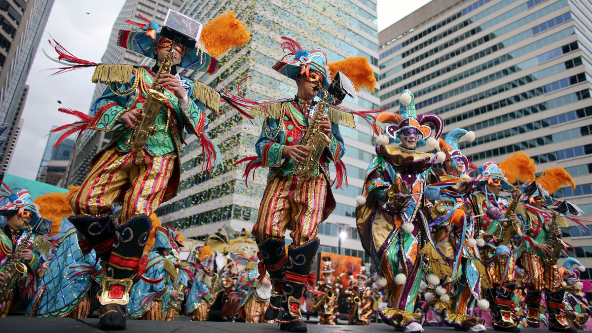  Members of the Aqua String Band perform during the 116th annual Mummers Parade in Philadelphia on Friday, Jan. 1, 2016. Outrageously costumed Mummers strutted their stuff Friday at the city's annual New Year's Day parade, a colorful celebration that features string bands, comic brigades, elaborate floats and plenty of feathers and sequins. (Joseph Kaczmarek/AP Photo) 