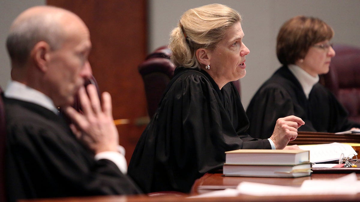  New Jersey Supreme Court justices listen to arguments in January. The court has ruled New Jersey did not break the law when it eliminated state-funded Medicaid benefits for legal immigrants who have been in the country  fewer than five years. (AP file photo) 