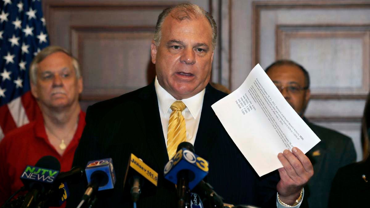  New Jersey Senate President Steve Sweeney holds up a paper that shows planned increases in the amount that public workers must contribute to their pensions under a previous agreement with the Christie administration. Earlier Tuesday, the New Jersey Supreme Court sided with Gov. Chris Christie in a fight with public worker unions over pension funds. New Jersey's top court overturned a lower-court judge's order that told the Republican governor and the Democrat-controlled Legislature to work out a way to increase pension contributions for the current fiscal year. (AP Photo/Mel Evans) 