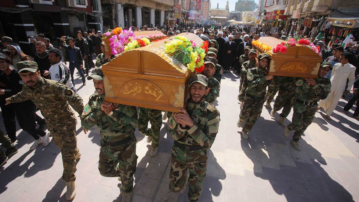  Mourners chant slogans against the Islamic State group during the funeral procession of three members of a Shiite group who were killed in Tikrit while fighting Islamic militants, in Najaf, Iraq, Wednesday. Iranian-backed Shiite militias and Sunni tribes have joined Iraq's military in a major operation to retake Tikrit from the Islamic State group. (Jaber al-Helo/AP Photo) 
