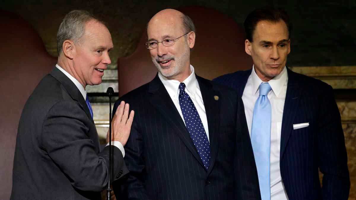  Pennsylvania Gov. Tom Wolf, center, speaks with Speaker of the House of Representatives, Rep. Mike Turzai, R-Allegheny, left, as Lt. Gov. Michael Stack looks on after Wolf delivered his budget address for the 2015-16 fiscal year. Wolf  praised the House Wednesday for passing a property tax-overhaul plan. (AP file photo) 