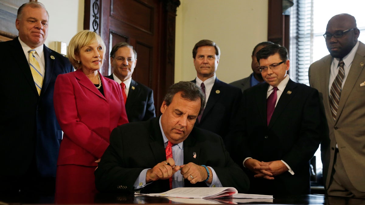  Gov. Chris Christie signs legislation in 2013 changing how the state awards tax breaks to businesses and developers. The bill consolidates New Jersey's five tax-incentive programs into two, one to give grants for creating jobs, the other to keep jobs from leaving the state. (AP file photo) 