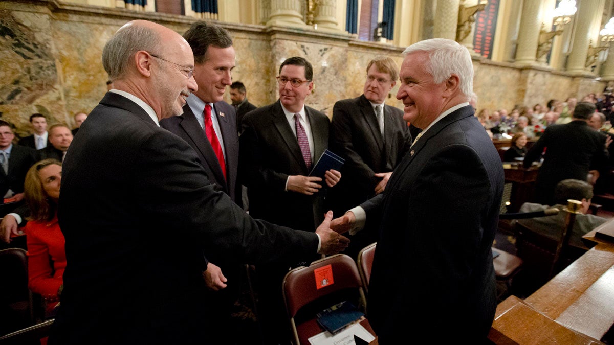  Democratic Gov.-elect Tom Wolf, left, shakes hands with Gov. Tom Corbett, right, as former U.S. Sen. Rick Santorum looks on Tuesday  before newly elected members of the Pennsylvania Legislature were sworn in. The Senate and House chambers both adjourned until Wolf's swearing in Jan. 20. (AP Photo/Matt Rourke 