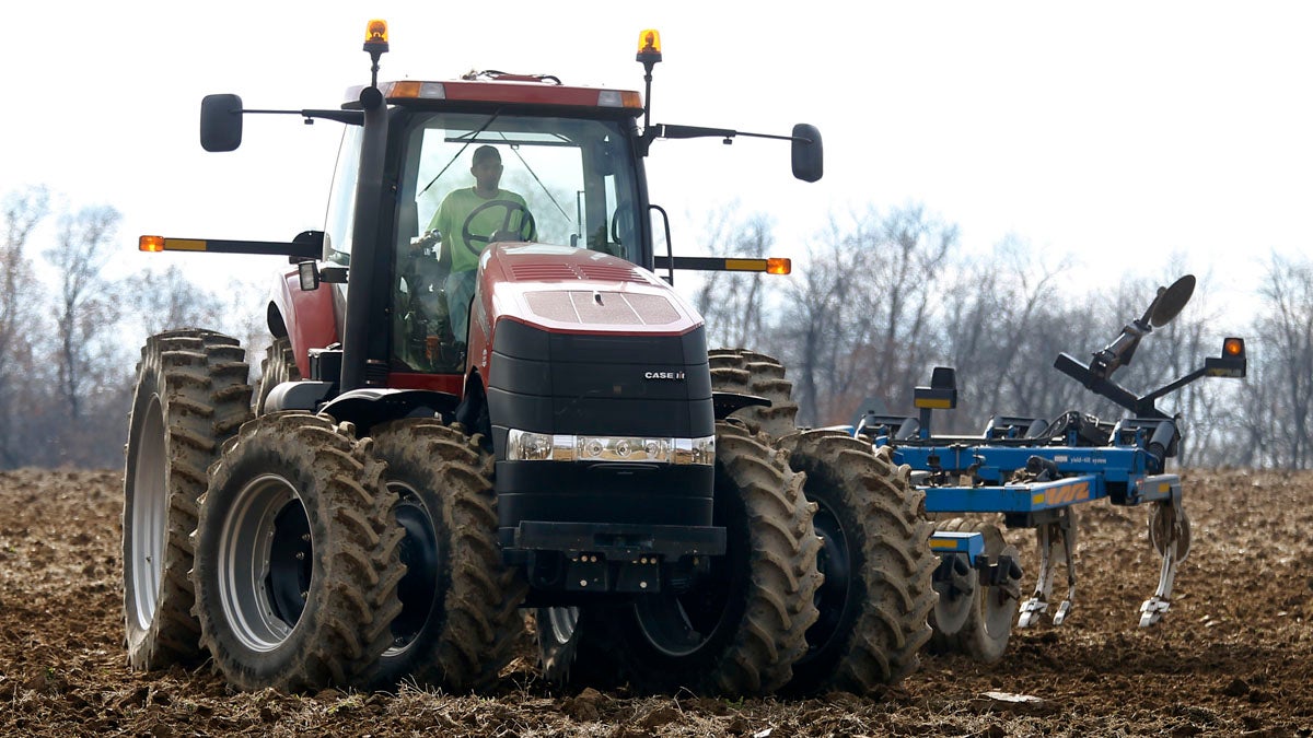  A farmer moves his tractor after turning over the soil in a field on a farm in Prospect, Pennsylvania. (AP Photo/Keith Srakocic) 